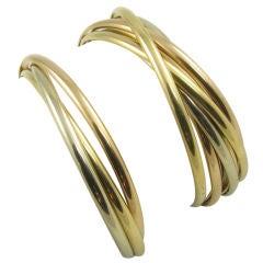 Set of two Cartier tri color gold rolling bangles