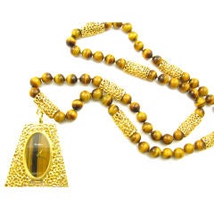 Vintage BUECHE GIROD dramatic tiger's eye and gold bead necklace.