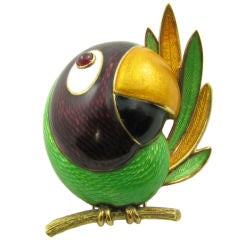A cheerful gold, enamel and ruby brooch designed as a Toucan.