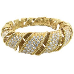 STERLE, Paris striking yellow gold and diamond bracelet.