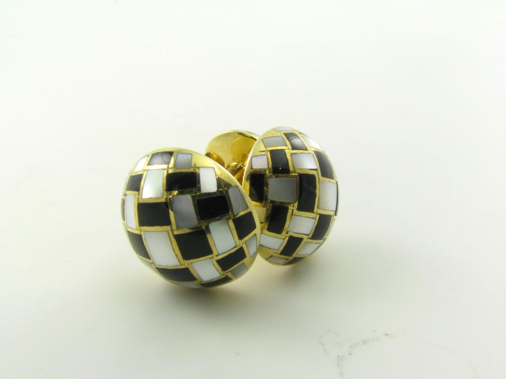 Women's TIFFANY & CO. gold, onyx and mother of pearl cufflinks.