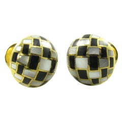 TIFFANY & CO. gold, onyx and mother of pearl cufflinks.