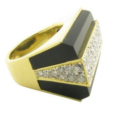 An incredible yellow gold, black onyx
diamond geometric ring. An incredible yellow gold, black onyx
diamond geometric ring.