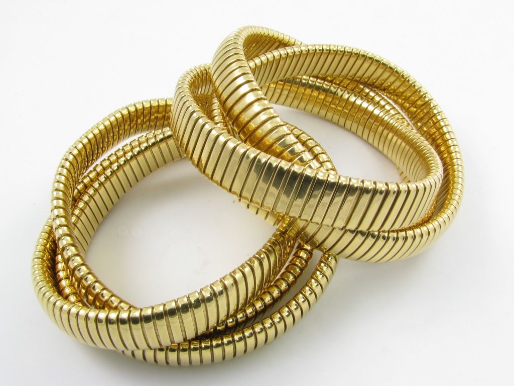 A pair of  interlocking gaspipe bracelets.