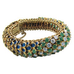 A fabulous gold, diamond, emerald and enamel bracelet.