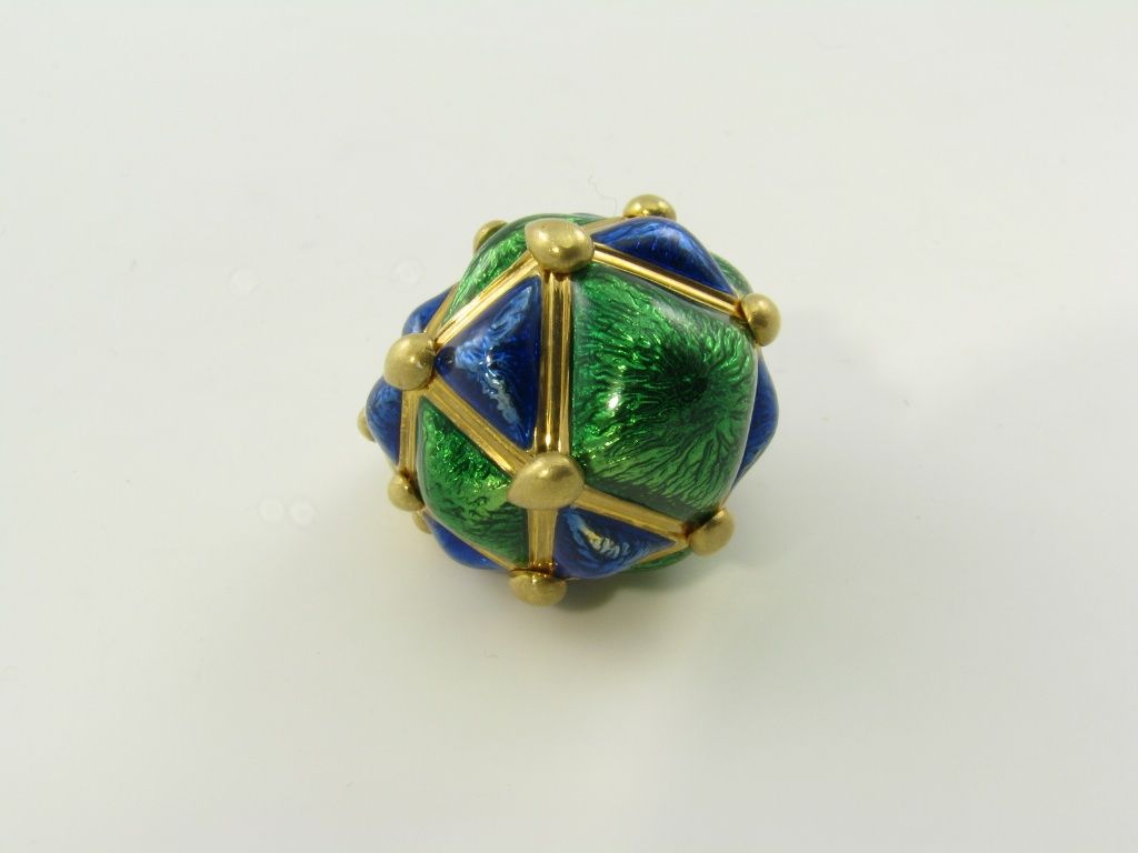 A chic yellow gold, blue and green enamel dome shaped ring