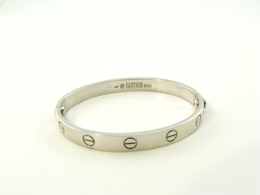 An 18 karat white gold LOVE bracelet.  Signed Cartier.  Serial # J09844. 1993.