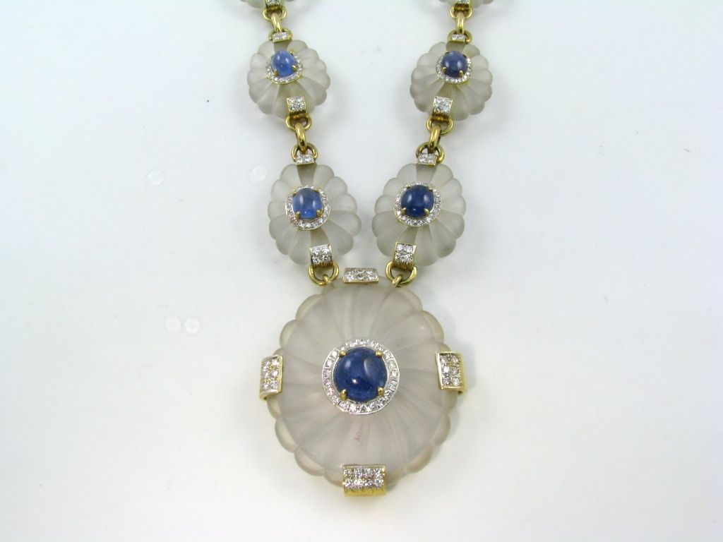 A spectacular frosted rock crystal, sapphire & diamond necklace.