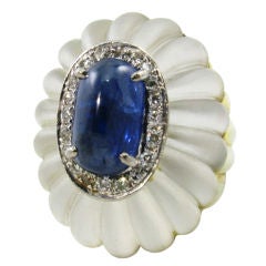 A fabulous fluted rock crystal, sapphire, diamond and gold ring. A fabulous fluted rock crystal, sapphire, diamond and gold ring.