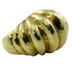 A stylish 18 karat hammered yellow gold dome shaped ring.