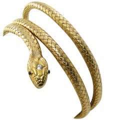 A fabulous yellow gold, sapphire and diamond snake bracelet.