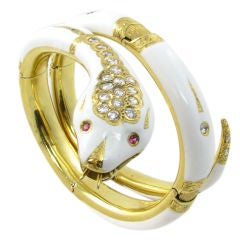 A spectacular gold, enamel, ruby and diamond snake bracelet.