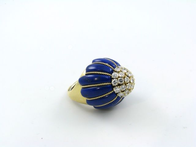 A bold lapis lazuli, gold and diamond dome shaped ring.