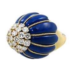 A bold lapis lazuli, gold and diamond dome shaped ring.