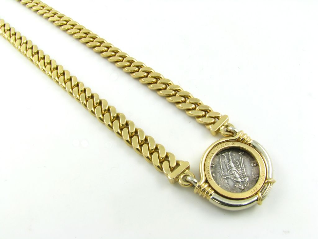 Women's BULGARI classic gold bezel set coin necklace.
