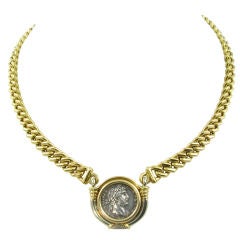 BULGARI classic gold bezel set coin necklace.