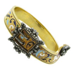 An exquisite champlevé enamel and diamond "jarretiere" bracelet