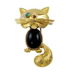 Vintage VAN CLEEF & ARPELS onyx, emerald & diamond winking cat brooch.