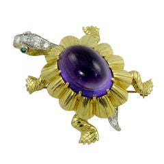 CARTIER whimsical amethyst, diamond, & emerald turtle brooch.