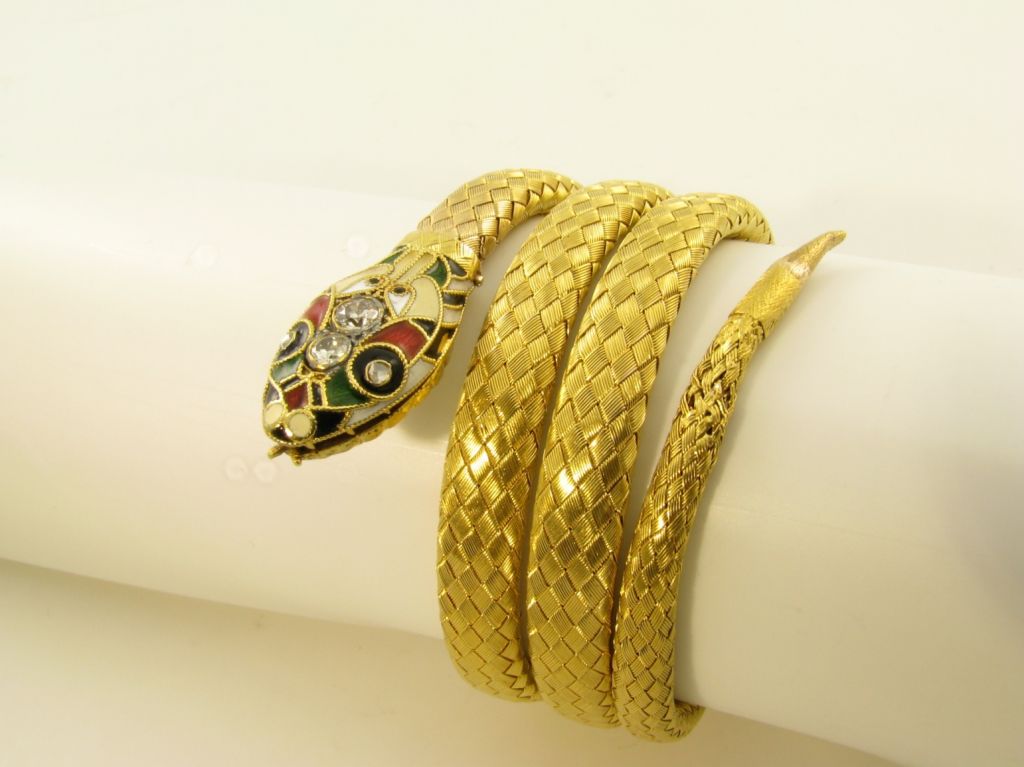 A chic enamel, diamond and gold snake bracelet.