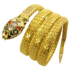 A chic enamel, diamond and gold snake bracelet.