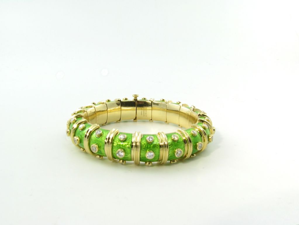 TIFFANY SCHLUMBERGER classic gold, enamel and diamond bangle.
