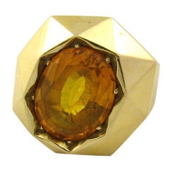 A fabulous oval shaped faceted citrine and gold dome shaped ring