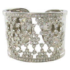 A wide bezel set diamond and white gold cuff bracelet