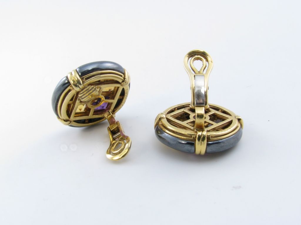 A pair of 18 karat yellow gold, hematite, diamond, citrine, and amethyst earrings.  Signed Bulgari.  Circa 1990’s.