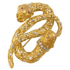 A Fabulous Gold, Ruby and Diamond Double Lion Head Brooch