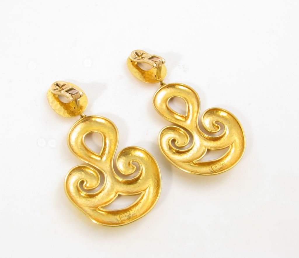 A pair of 18 karat yellow gold earrings.  Signed Lalaounis.  Designed as hammered, hanging plaques with a swirl design.  Approximate weight of earrings is 26.6 grams.