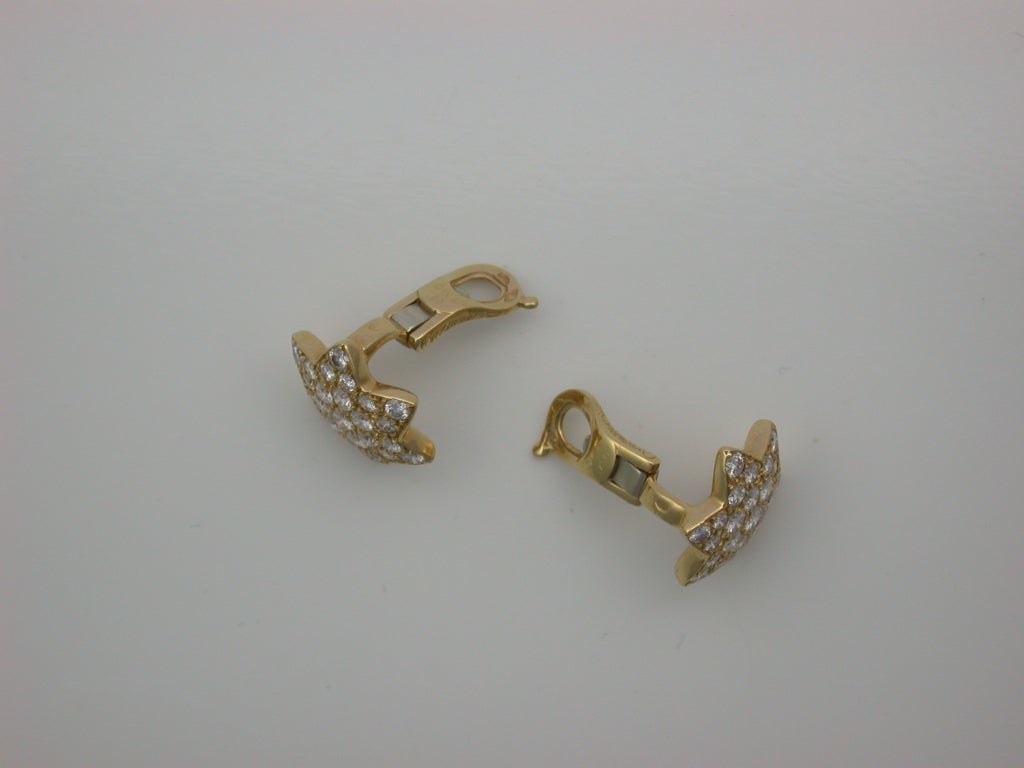 Small and tasteful, designed as six-pointed stars, mounted in yellow gold, pave-set with 52 white circular-cut diamonds (approximately 2 1/2 carats total), with sturdy clip backs (post can easily be added), signed VCA for Van Cleef & Arpels, stamped