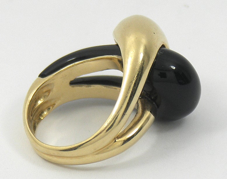 14K Yellow Gold and onyx intertwined in the Yin and Yang form.
Designer MAZ puts a newer twist to an older idea. The ring
is presently size 6 1/2.