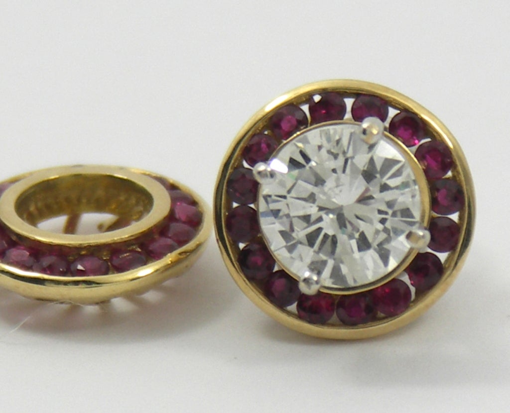 18K Yellow gold and ruby stud earring jackets. Shown with 
a 1.65CT diamond stud earrings (Not Included). These lively
ruby jackets will handle a stud earring from 1.00CT to 1.65CT.
