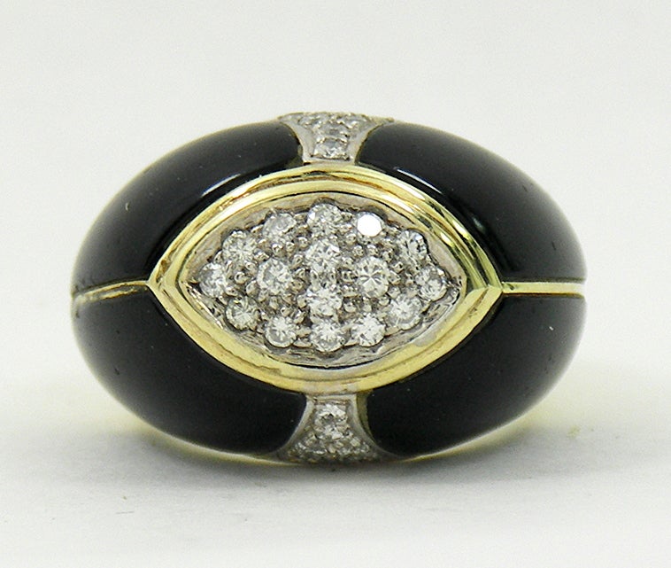 This tailored, 14K yellow gold onyx and diamond dome ring
is set with 30 diamonds weighing an approximate total of .75CT
of overall H color and SI1 clarity. It measures 1" across and 5/8"
north to south. The ring size is 6 1/2. Weight 15.4