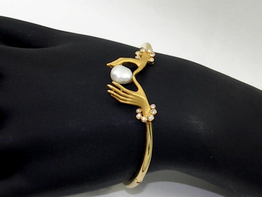 One ladies 18K yellow gold bracelet by Carrera y Carrera. Featuring the notable 