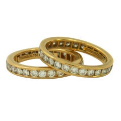 A Pair of Tiffany Diamond Gold Eternity Bands