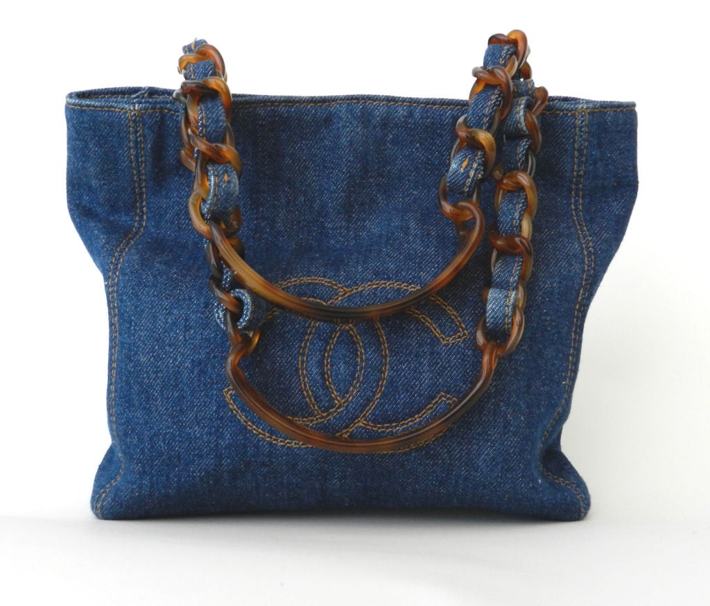 Chanel denim purse with plastic tortoise handles.  Body of purse measures 11 x 8 inches. Excellent vintage condition.