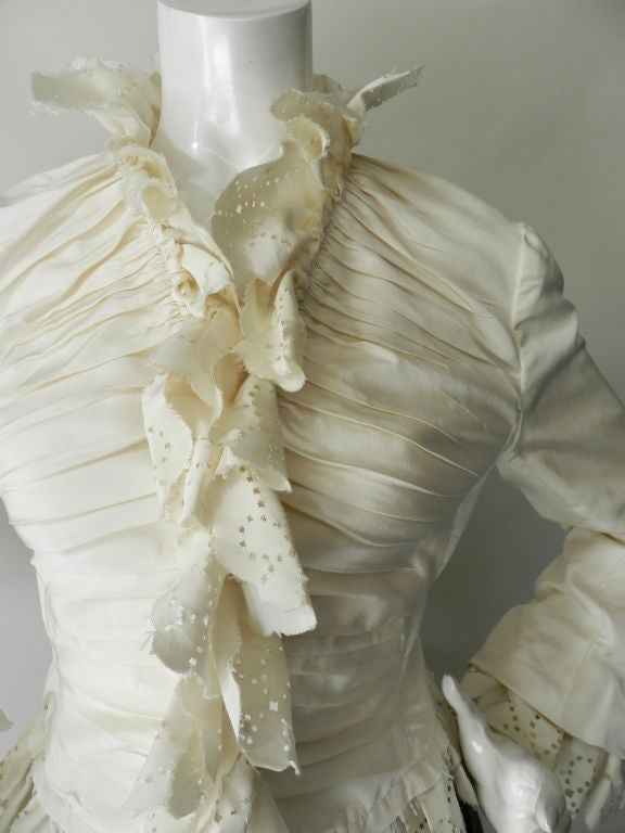 Alexander McQueen ivory silk Victorian inspired jacket.  From the Spring 2003 ready to wear Irere Collection that featured his Oyster Dress.  The Collection was inspired by the voyages of the great explorers like Columbus and Captian Cook,and showed