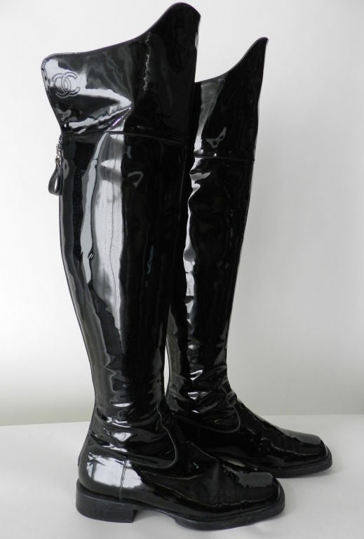 Chanel tall patent leather boots. Can be worn over the knee or folded down. CC logo is embossed on both sides. Zippers up the back calf. Excellent condition.<br />
<br />
Measurements:<br />
size 36.5<br />
measures 22.5