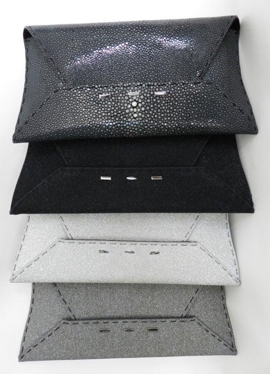 Here are 4 VBH Manila envelope clutch bags. Designer Vernon Bruce Hoeksema worked for Valentino.  Each clutch has 3 signature metal tabs at front, is lined with suede, and comes with dustbag. Measures 10.25