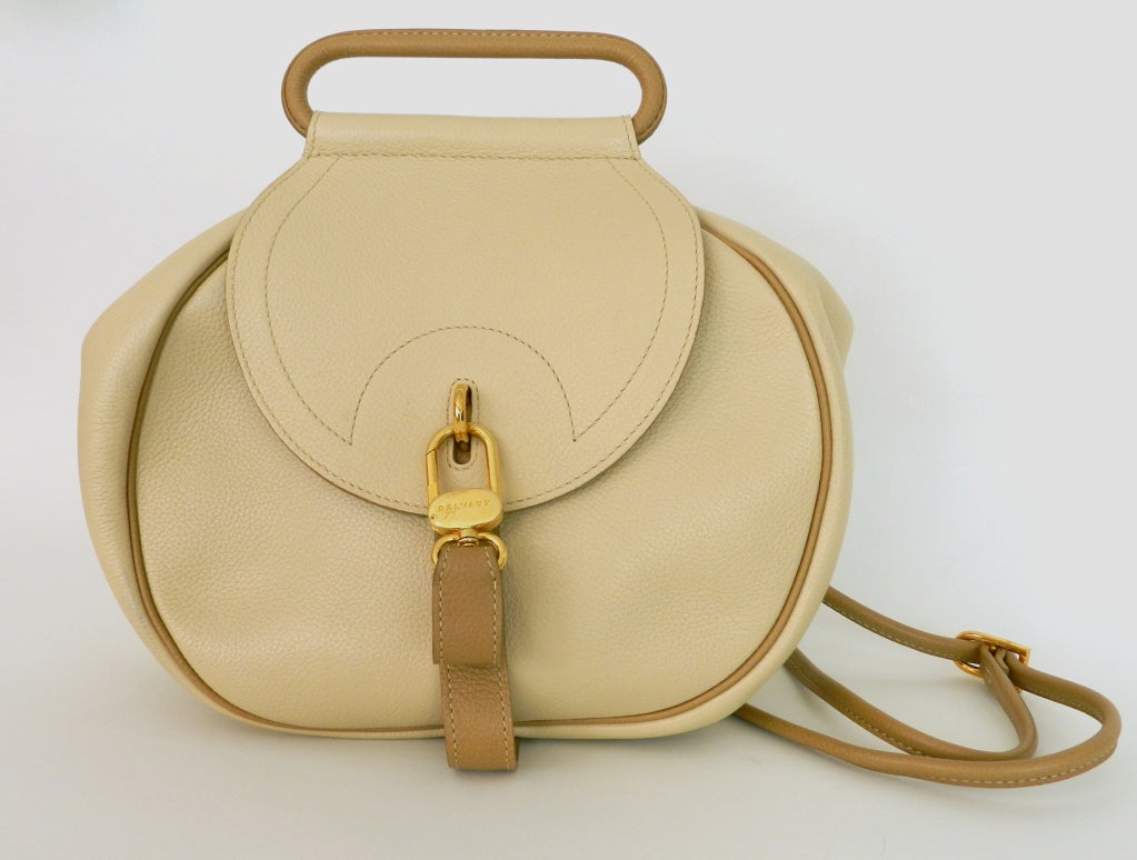 Vintage Delvaux bag / purse.  Founded in 1829, Delvaux is the oldest fine leathergoods company in the world. Colours are much nicer beige and taupe in person. Goldtone metal hardware. Excellent clean interior as if never used.