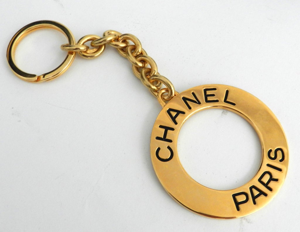 Chanel large goldtone metal logo keychain. Original box and tag. Dated 93A. Measures 6 1/4