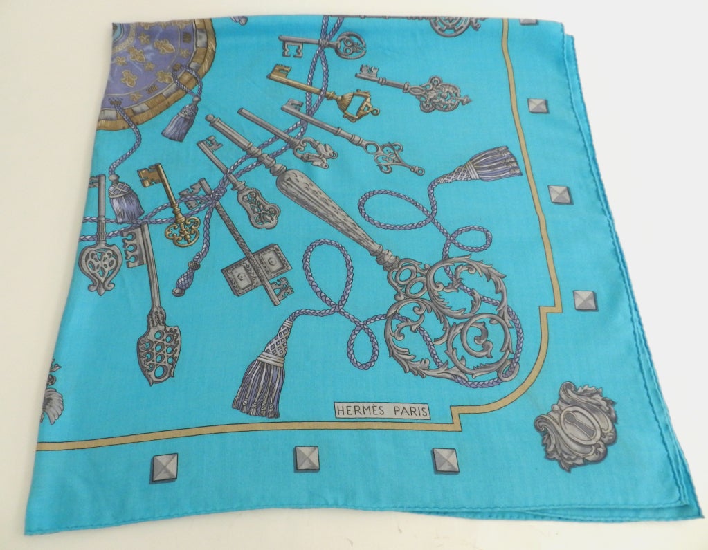 Hermes turquoise cashmere large scarf/shawl. Measures 53 x 53 inches. Overall good previously owned condition with no stains or holes, but some light surface wear to fabric.