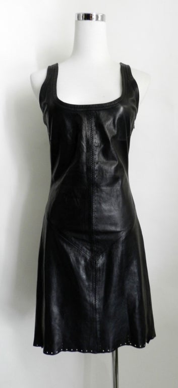 Helmut Lang Spring 2001 black leather runway dress.  Helmut Lang stopped designing for the label in 2005 after acquisition by Prada group in 2004. The dress has scoop neckline, side zipper, raw hem with laser-cut details, zig-zag top-stitched seams,