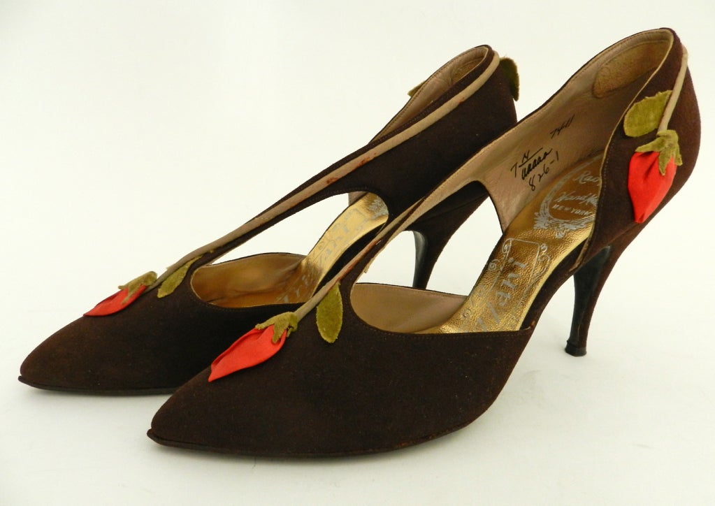 Vintage circa late 1950's or early 1960's shoes. Gorgeous and recommended for display or collection as they are marked size 7 AAAAA and will likely not fit a modern person's foot.  Excellent vintage condition with brown suede and silk floral accent.