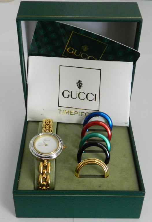 Vintage Gucci goldtone metal link watch with interchangeable bezels. Original box and papers.
Measures 7.5