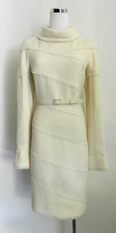 Chanel 08A ivory wool runway dress.  Fold down collar, fringed hems, centre back zipper, matching enamel buckle belt, 6 enamel maltese cross buttons at cuffs.  Excellent hardly worn condition. 100% wool exterior and silk