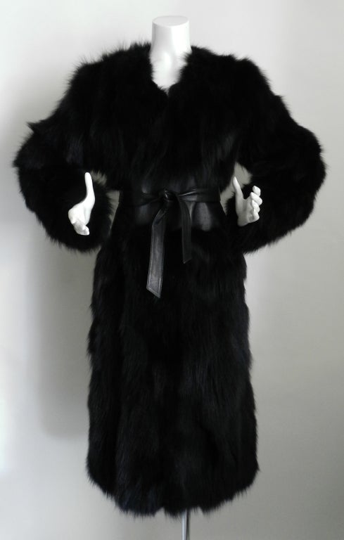 Yves Saint Laurent Haute Couture black fur coat and matching fur scarf.  Wrap style design with leather waist and sash belt. Excellent condition. Shoulder to shoulder seam of interior lining is 17