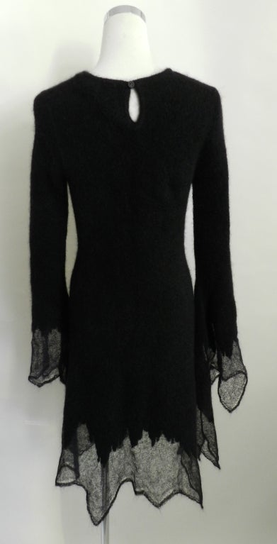 Chanel 09A black mohair sweater dress. Simple pull-over design with one button at back neck, sheer knit cuffs and skirt hem. Fully lined in Chanel camilia floral jacquard silk.  Excellent condition - worn once. Material content is 52 mohair, 24